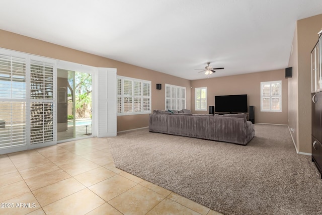 1268 N Pine St, Gilbert, AZ 85233 - carpeted living area featuring ceiling fan and tile patterned floors
