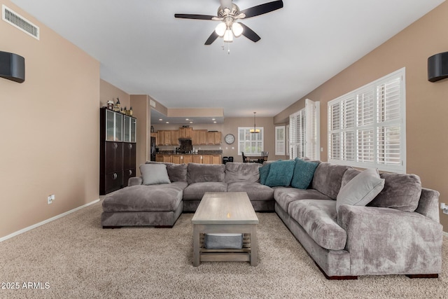 1268 N Pine St, Gilbert, AZ 85233 - living area featuring light carpet and a ceiling fan