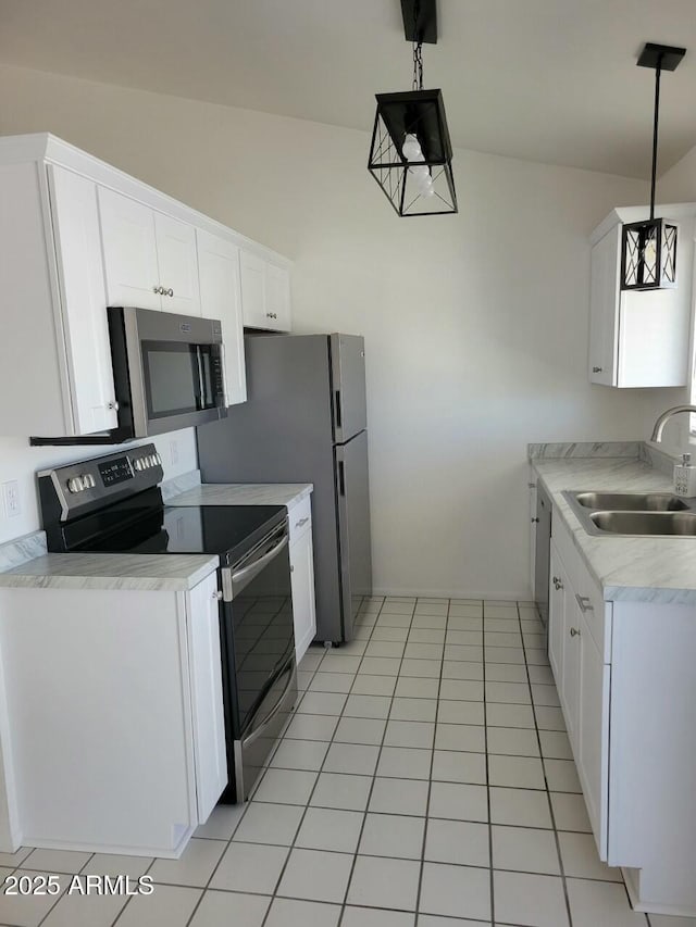 kitchen with white cabinetry, sink, pendant lighting, and stainless steel appliances