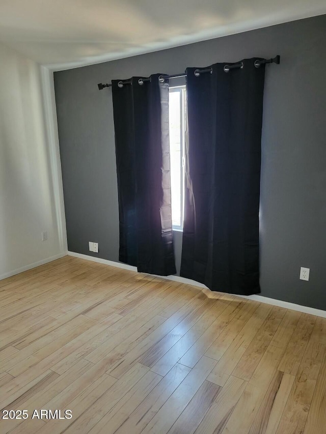 empty room with light wood-type flooring