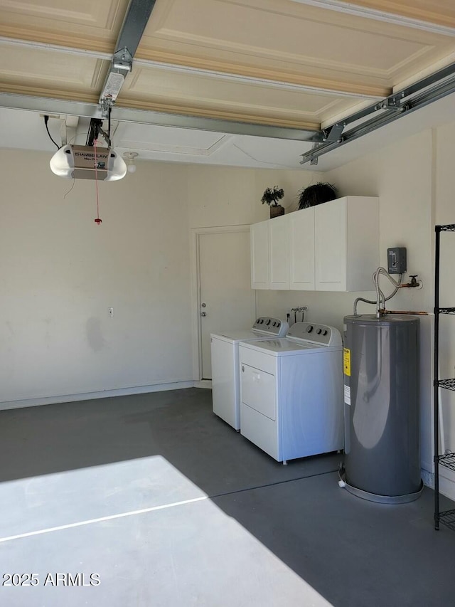 garage with washer and dryer, a garage door opener, and water heater