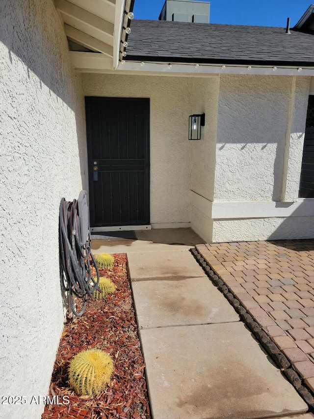 doorway to property with a patio area