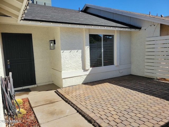 property entrance featuring a patio