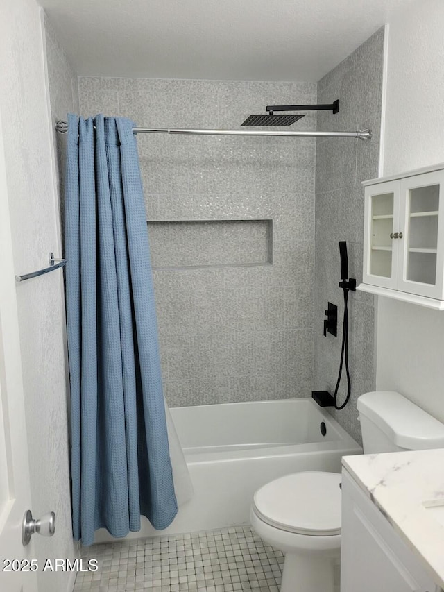 full bathroom with vanity, tile patterned flooring, toilet, and shower / bathtub combination with curtain