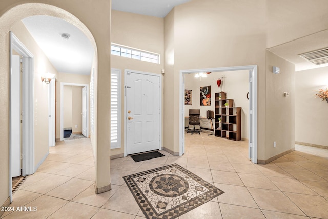 entryway with light tile patterned floors