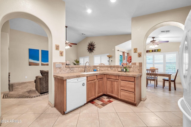 kitchen with light tile patterned floors, sink, white appliances, lofted ceiling, and ceiling fan