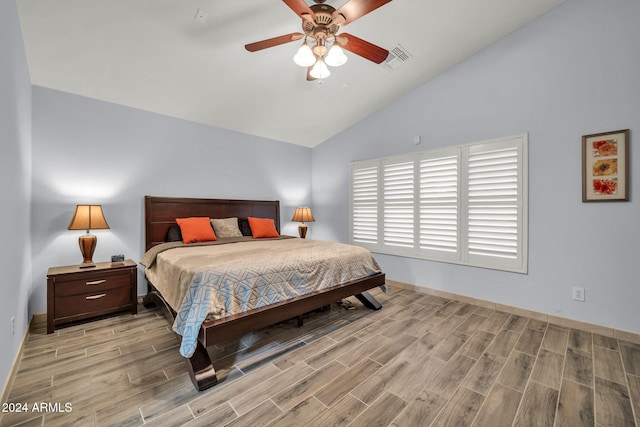 bedroom featuring high vaulted ceiling, light hardwood / wood-style flooring, and ceiling fan