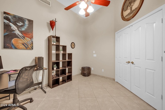 tiled home office with ceiling fan