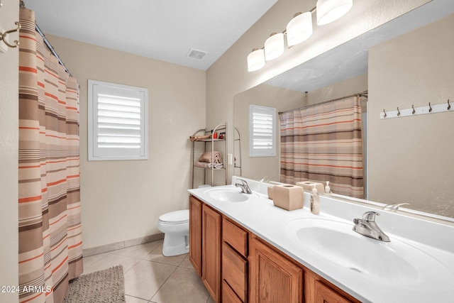 bathroom featuring vanity, tile patterned floors, toilet, and a shower with curtain