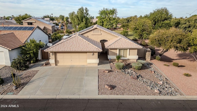 view of front of property with a garage