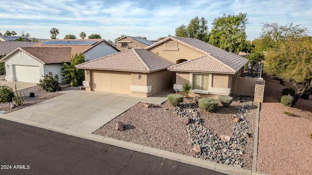 ranch-style home featuring a garage