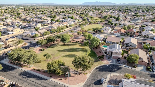 birds eye view of property with a mountain view