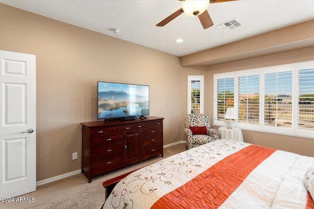 bedroom featuring ceiling fan and light carpet