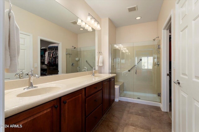 bathroom with vanity and an enclosed shower