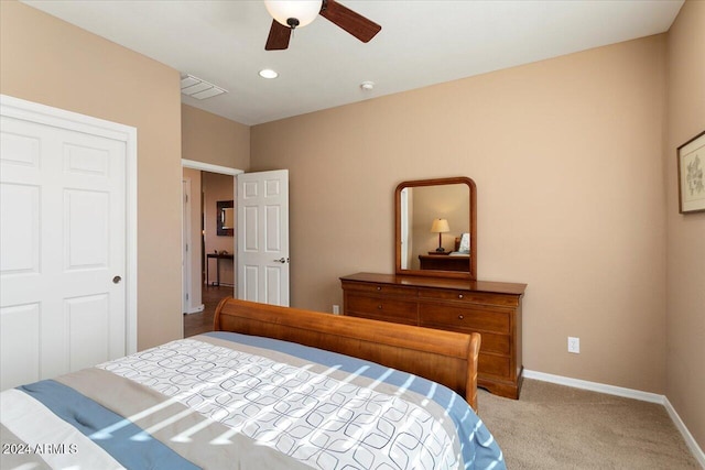 bedroom with light carpet and ceiling fan