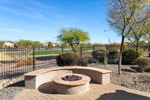 view of patio / terrace featuring a fire pit