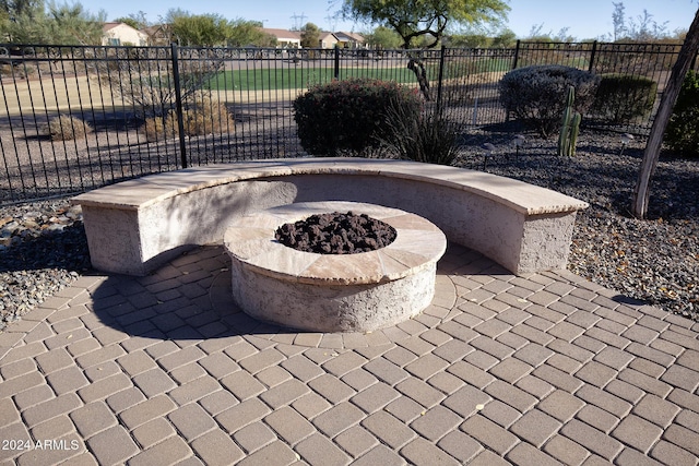 view of patio / terrace with an outdoor fire pit