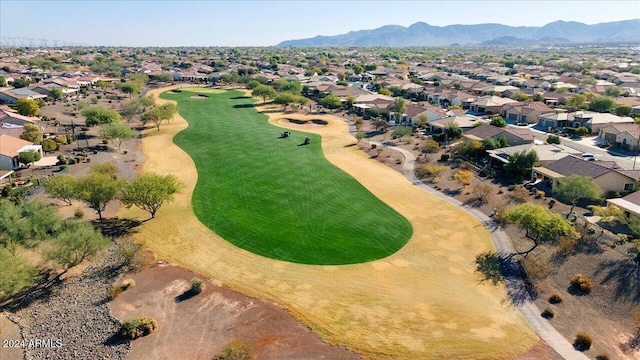 birds eye view of property with a mountain view