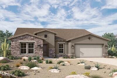 view of front of property with stucco siding, a garage, stone siding, driveway, and a tiled roof