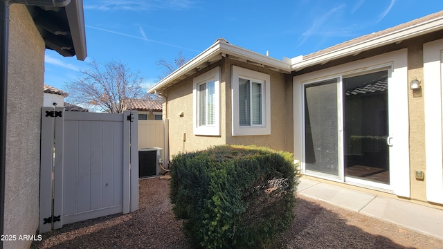 view of side of home featuring cooling unit