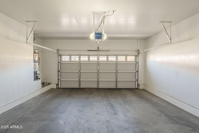 1170 S Agnes Ln, Gilbert, AZ 85296 - garage with water heater, baseboards, and a garage door opener