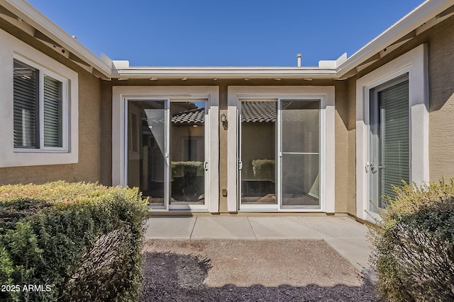 1170 S Agnes Ln, Gilbert, AZ 85296 - entrance to property with a patio area and stucco siding