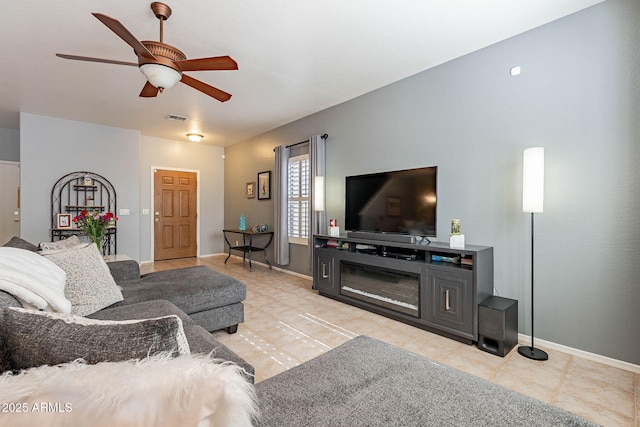 tiled living room featuring ceiling fan