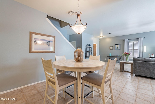 view of tiled dining space