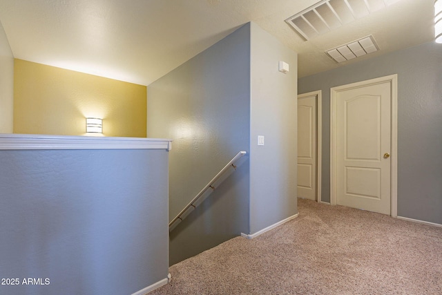 stairs featuring carpet floors