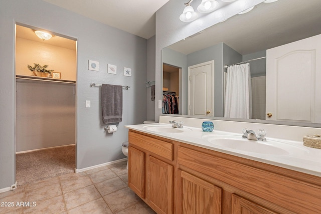 bathroom featuring tile patterned floors and vanity