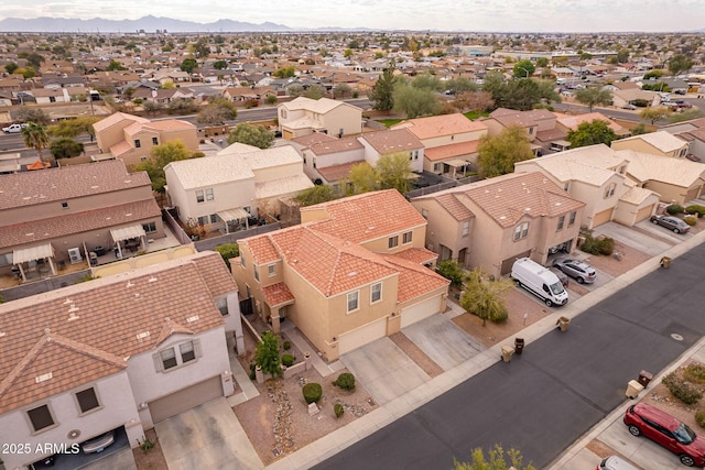 birds eye view of property with a mountain view