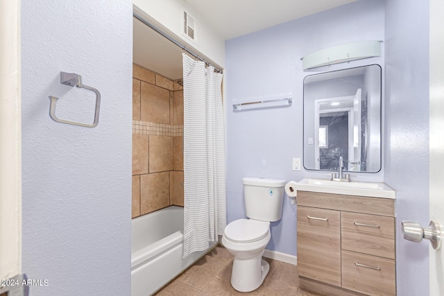 full bathroom with tile patterned flooring, vanity, toilet, and shower / bath combo with shower curtain