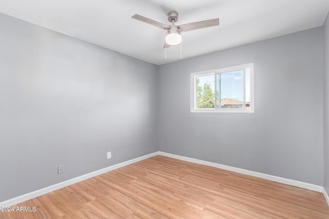 unfurnished room with ceiling fan and light hardwood / wood-style flooring