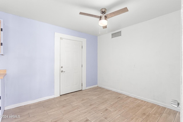 spare room with ceiling fan