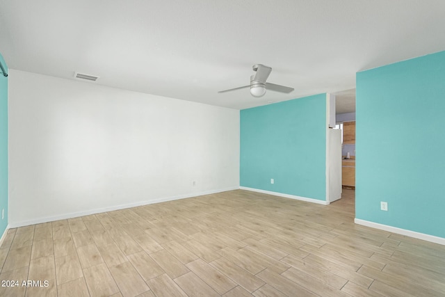 unfurnished room featuring ceiling fan and light hardwood / wood-style floors