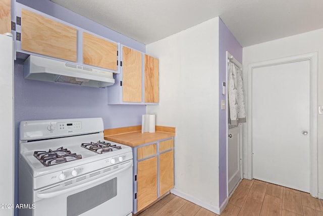 kitchen with white gas stove