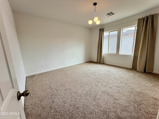 spare room featuring carpet flooring