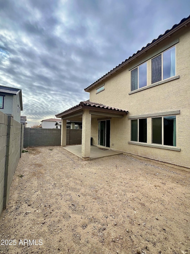 rear view of property featuring a patio