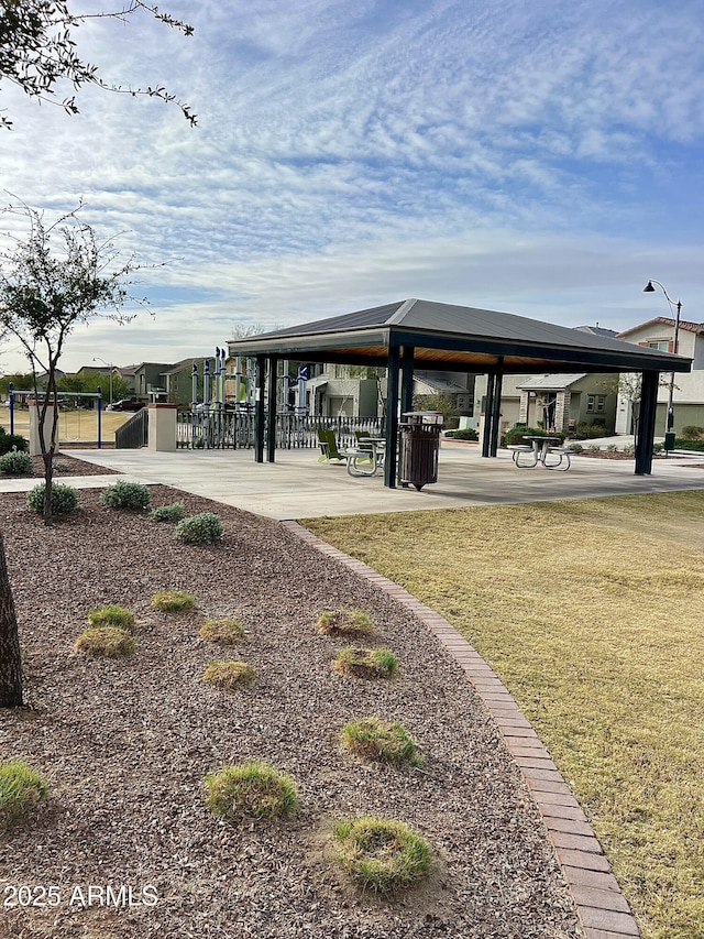 view of property's community with a gazebo and a lawn