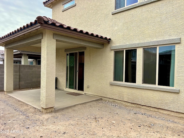 rear view of property with a patio area