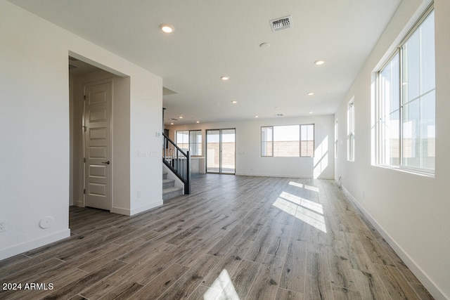 unfurnished living room with hardwood / wood-style floors