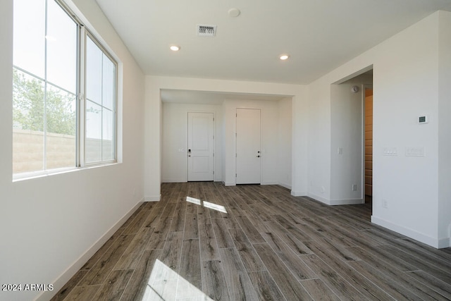 spare room with dark wood-type flooring