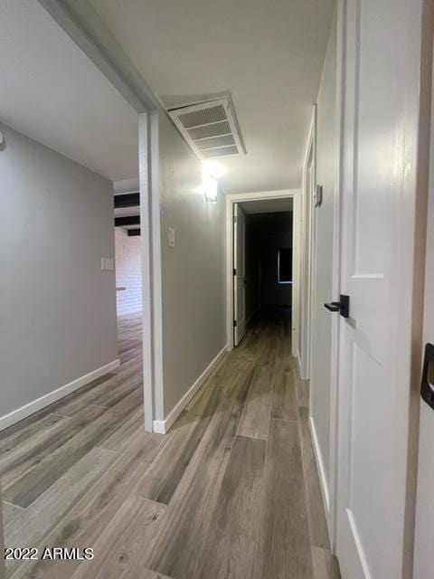 corridor featuring light hardwood / wood-style floors