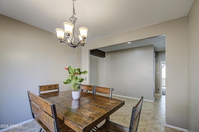 6811 W Darrel Rd, Laveen, AZ 85339 - dining space with baseboards, a notable chandelier, and light tile patterned floors
