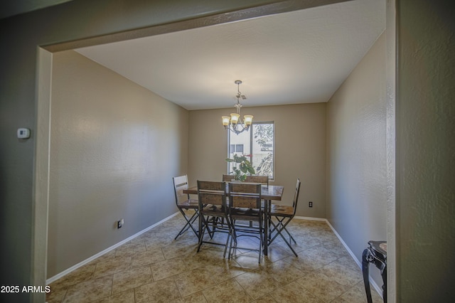 6811 W Darrel Rd, Laveen, AZ 85339 - dining area featuring a chandelier, light tile patterned flooring, and baseboards