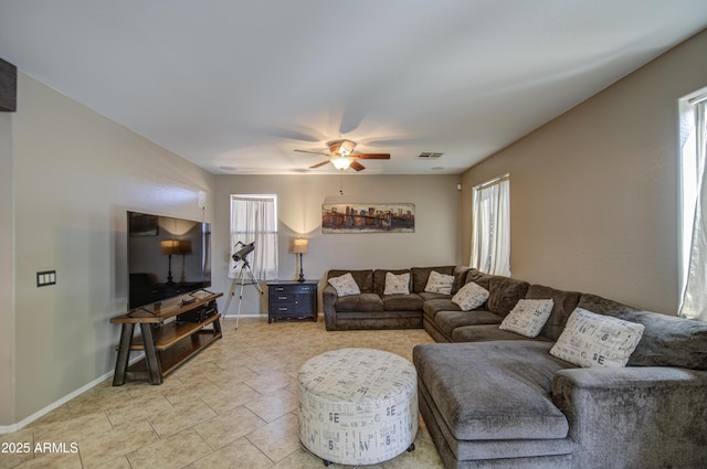 6811 W Darrel Rd, Laveen, AZ 85339 - living room with visible vents, baseboards, and a ceiling fan