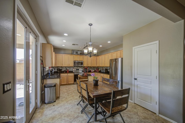 6811 W Darrel Rd, Laveen, AZ 85339 - dining space with light tile patterned floors, a wealth of natural light, a notable chandelier, and visible vents