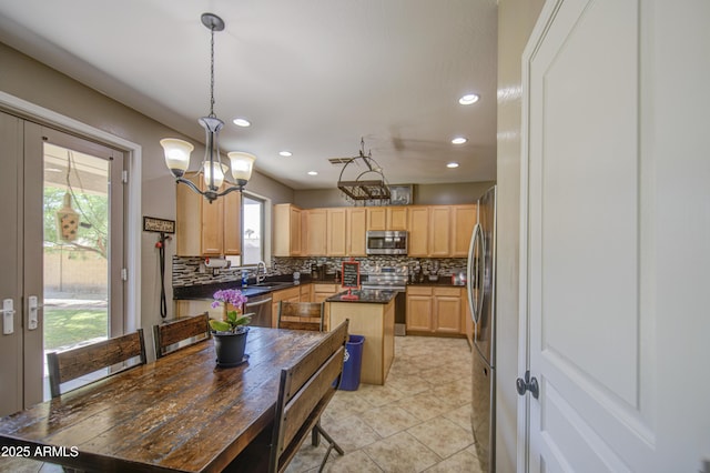 6811 W Darrel Rd, Laveen, AZ 85339 - kitchen with dark countertops, stainless steel appliances, light brown cabinets, decorative backsplash, and recessed lighting