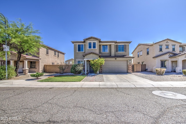 6811 W Darrel Rd, Laveen, AZ 85339 - traditional-style house with concrete driveway, stone siding, a garage, and fence
