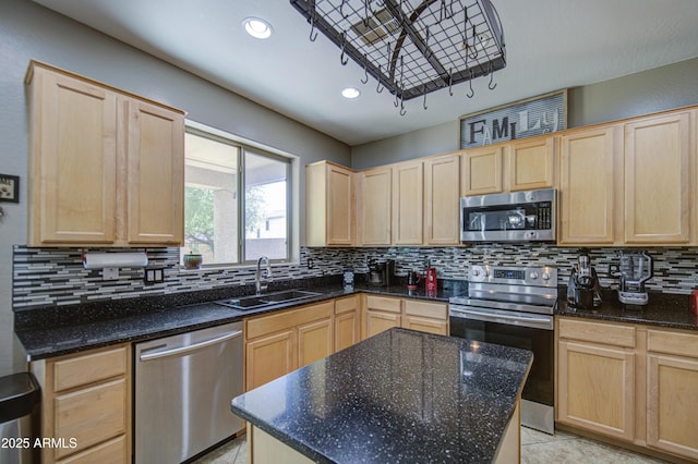 6811 W Darrel Rd, Laveen, AZ 85339 - kitchen with light brown cabinetry, a sink, dark stone countertops, stainless steel appliances, and tasteful backsplash